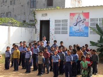 Volunteer with a child in India